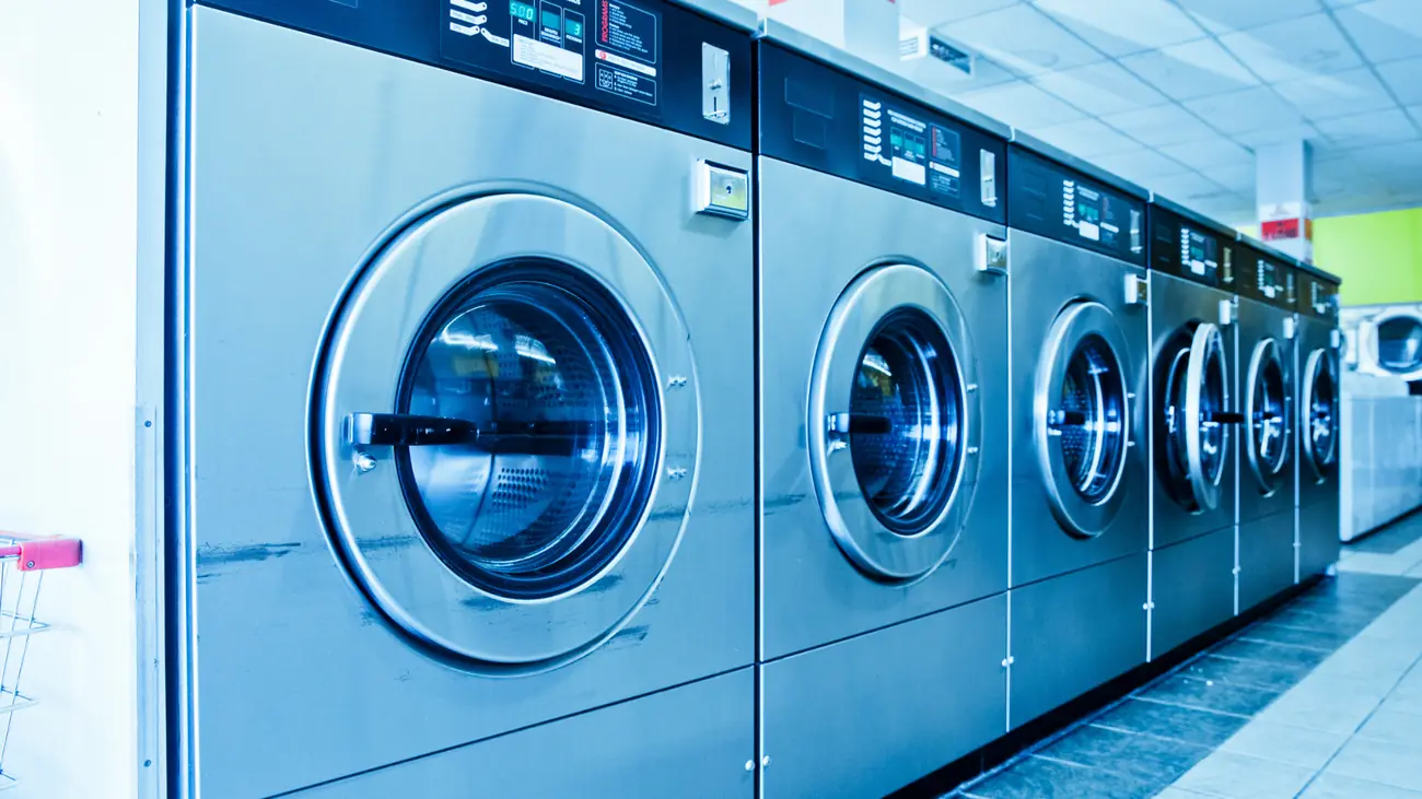 Row of commercial washing machines