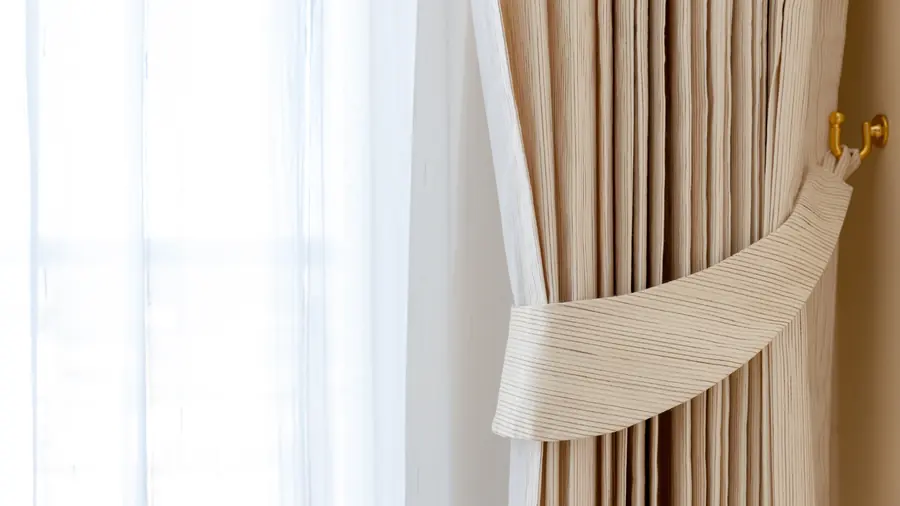 Cleaned curtains hanging at a bright window