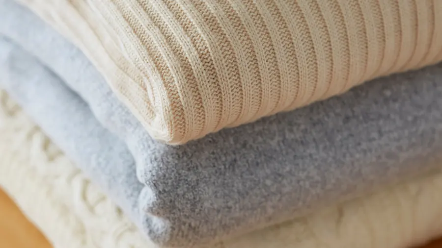 Folded wool blankets and duvets